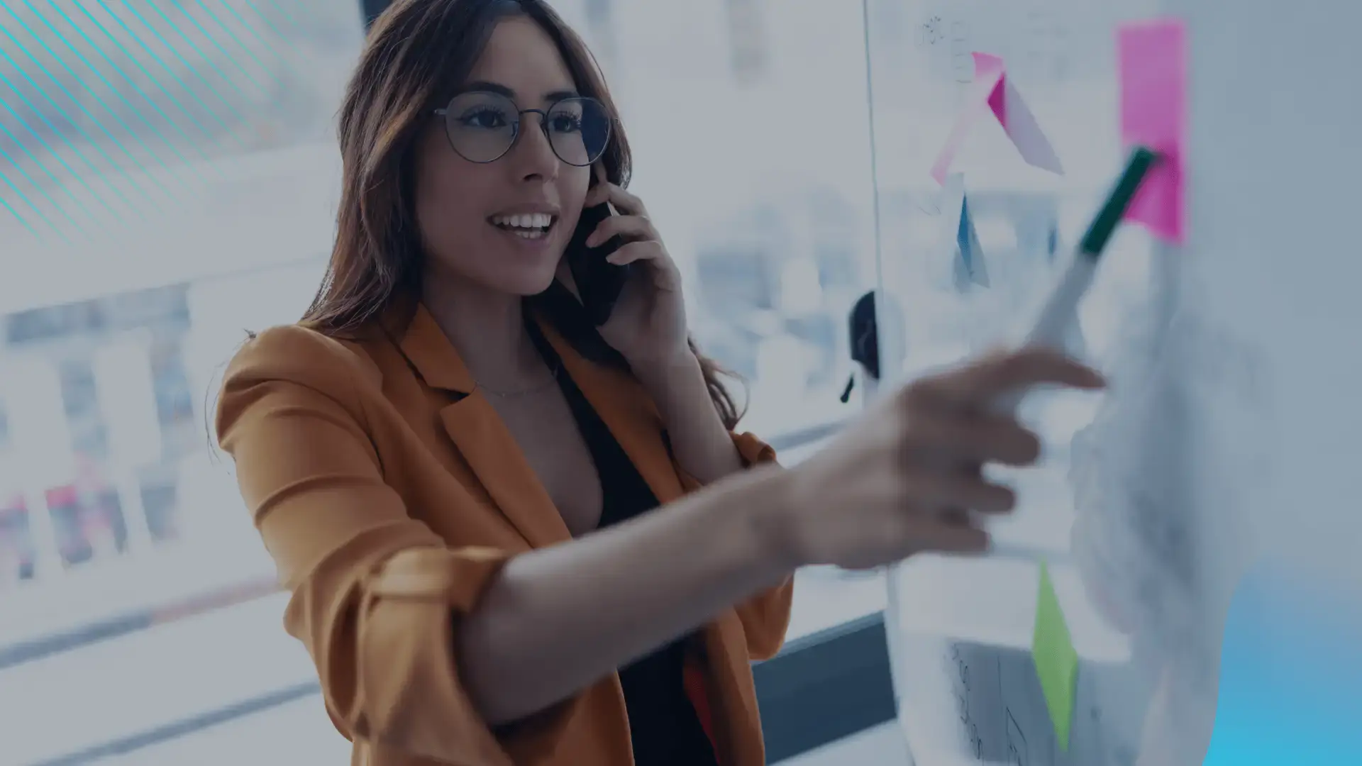 Woman presening sales strategy pointing to a white board